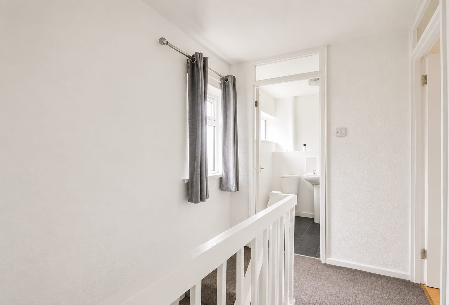 Freshly painted landing and staircase — South Wales decorating project