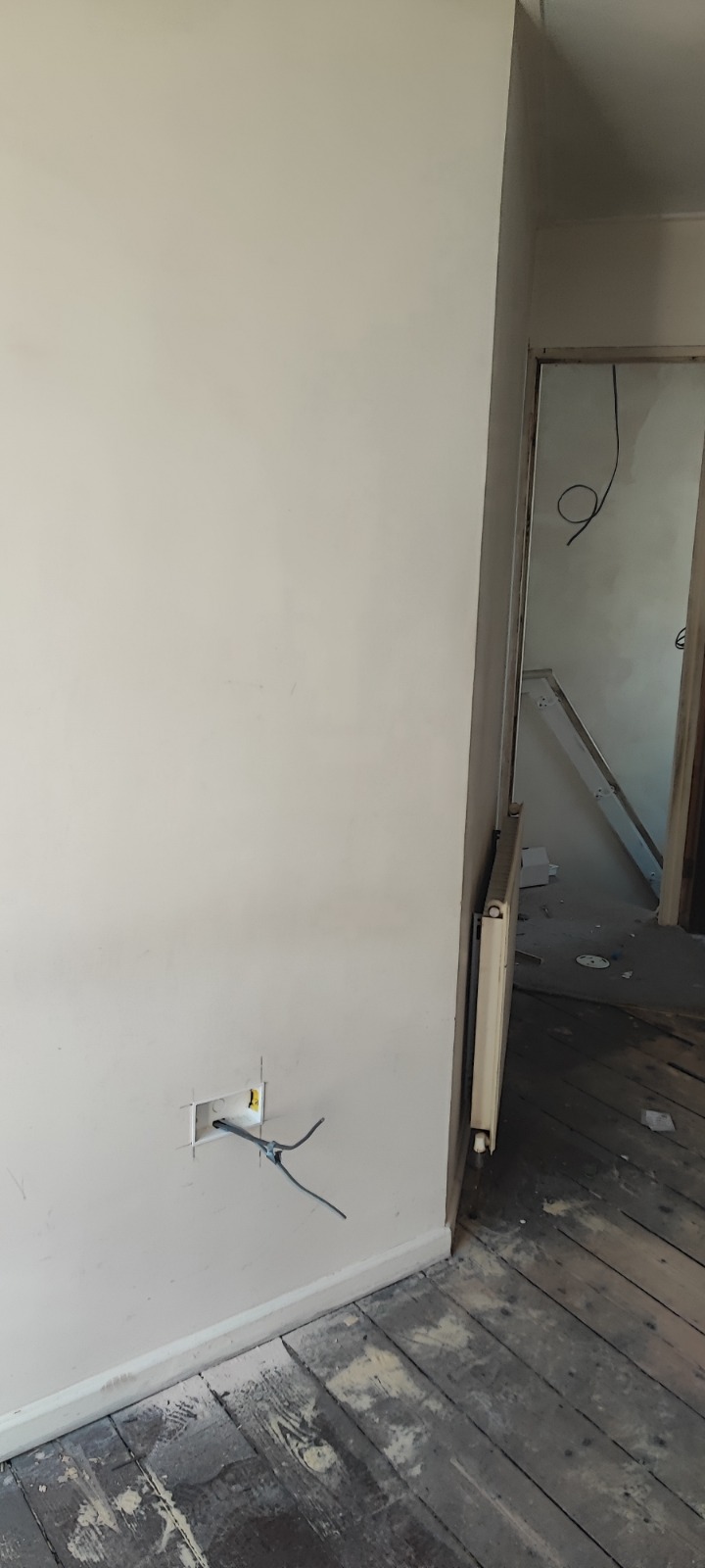 Stripped reception room mid-refurbishment with new plaster — Newport