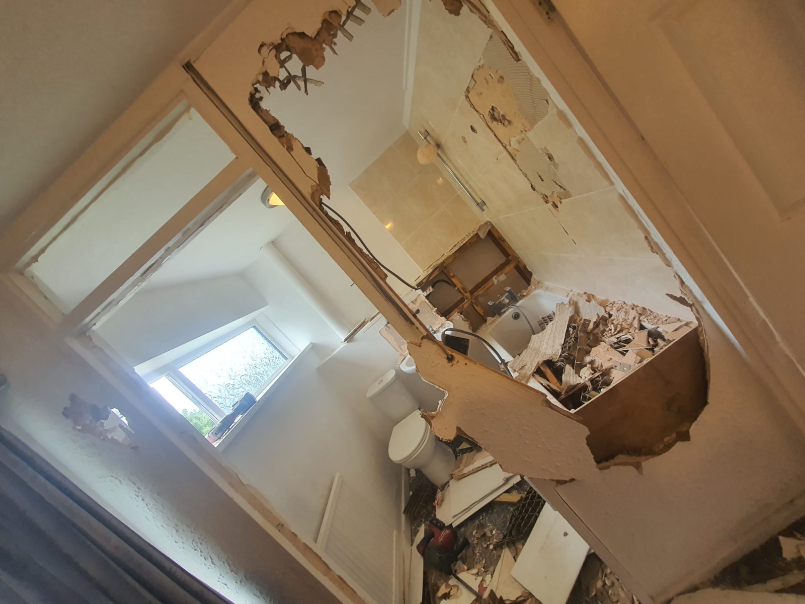 Bathroom strip-out overhead view — full refurbishment, South Wales